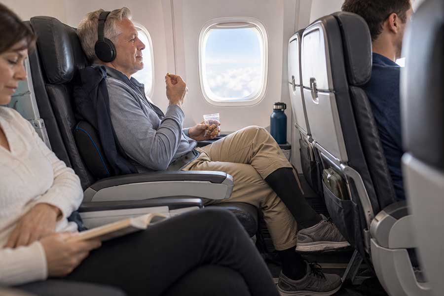 Snacks and a water bottle packed for a comfortable flight