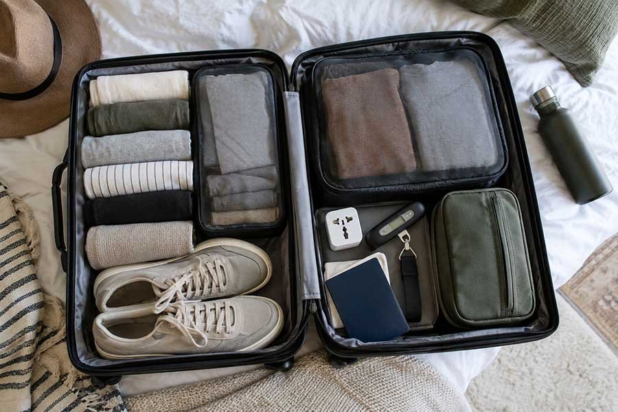 Passport, documents, and a suitcase packed for international travel