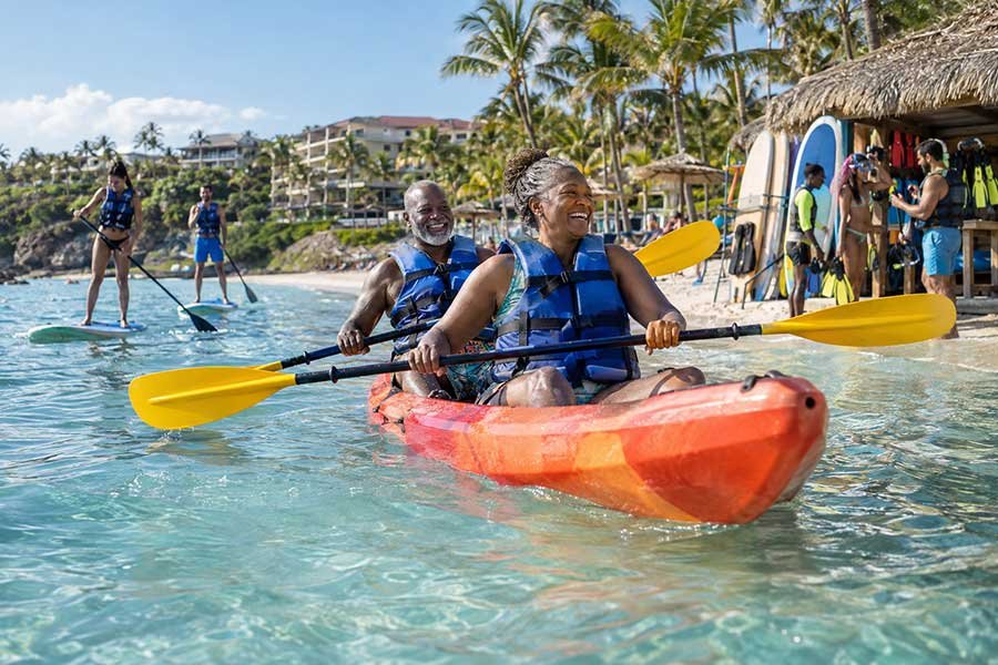 A traveler reviewing resort fees before an all inclusive trip