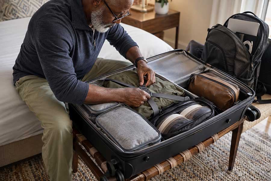 Entertainment and comfort items packed for a flight
