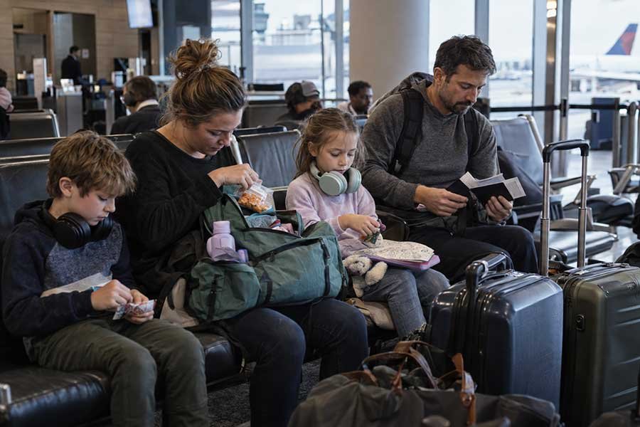 Kids playing with travel activities on an airplane tray table