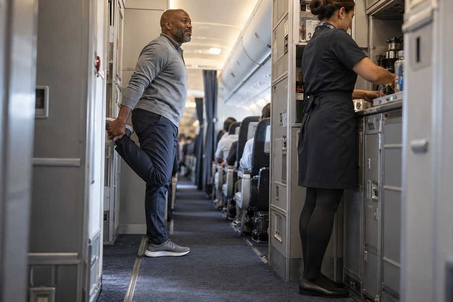 A traveler checking a seat map before choosing an economy seat