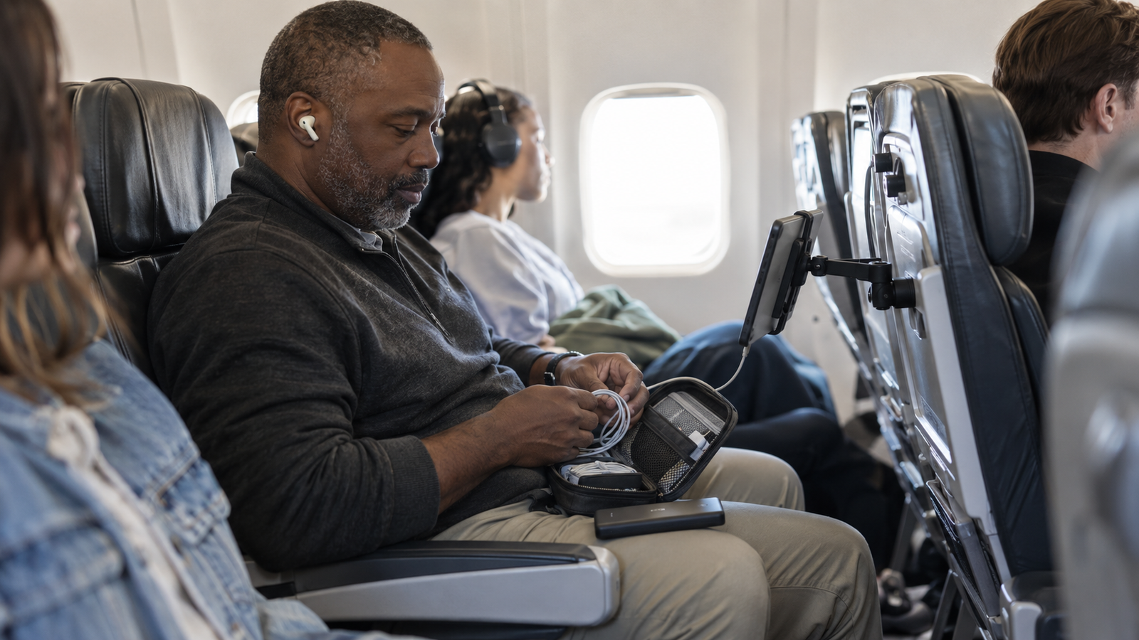 A traveler downloading offline maps before a long flight
