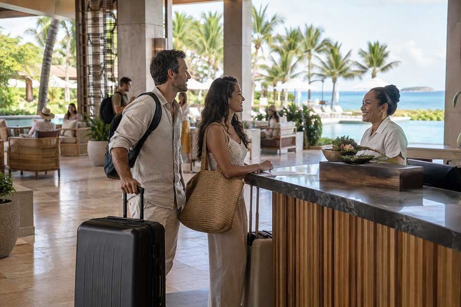 Traveler relaxing at an all-inclusive resort with pools and ocean views