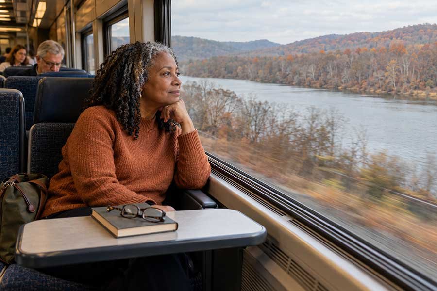 Quiet autumn river train ride with passengers enjoying the scenery on Thanksgiving weekend
