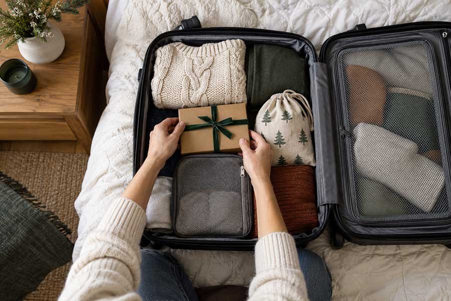 Packing holiday gifts neatly into a carry-on bag